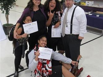 Proud mother poses with her honor roll daughter.